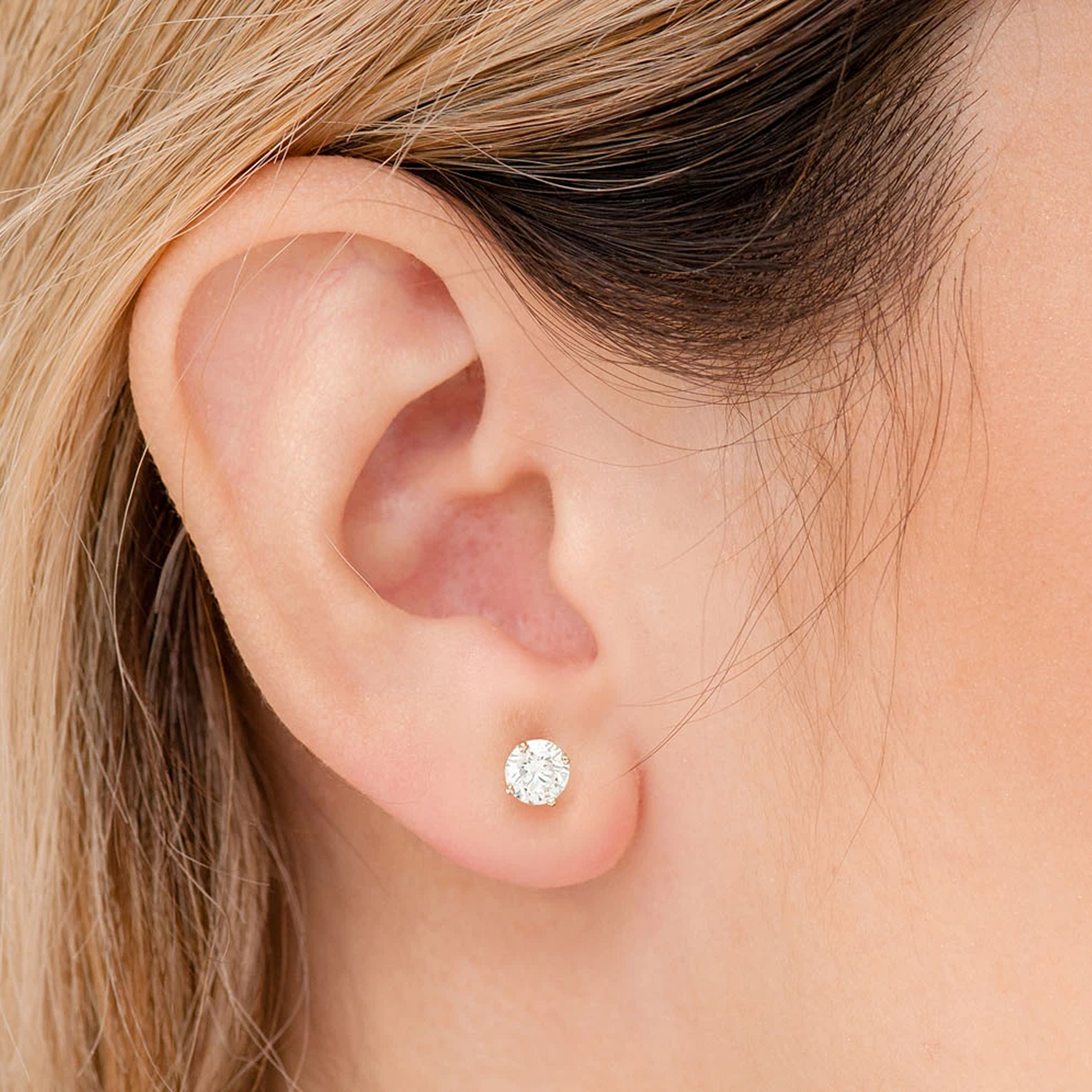 Solitaire Diamond Studs in 14K yellow gold, 0.33ctw, angled view