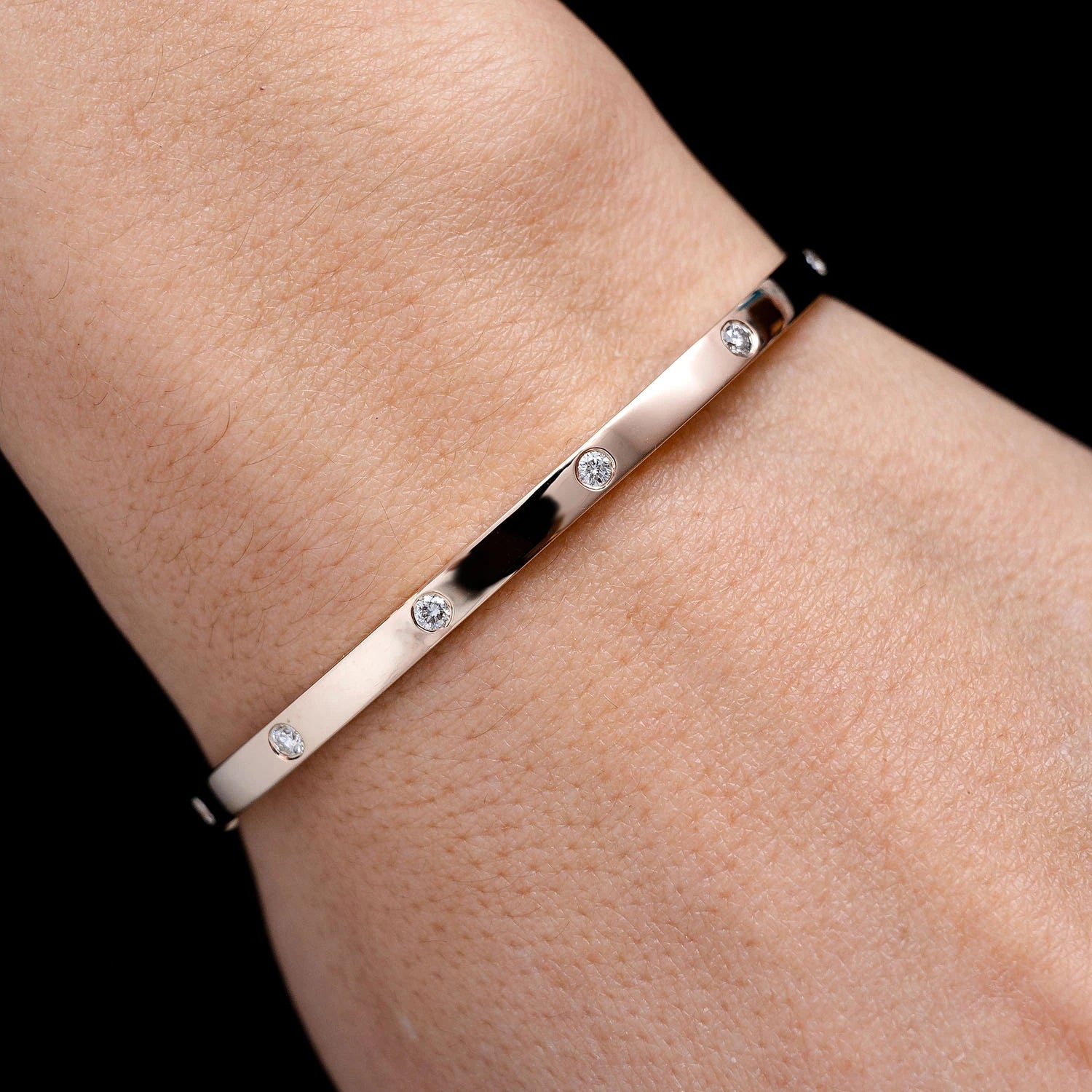 Thin Flush Set Diamond Bangle Bracelet in 14K rose gold, angled view