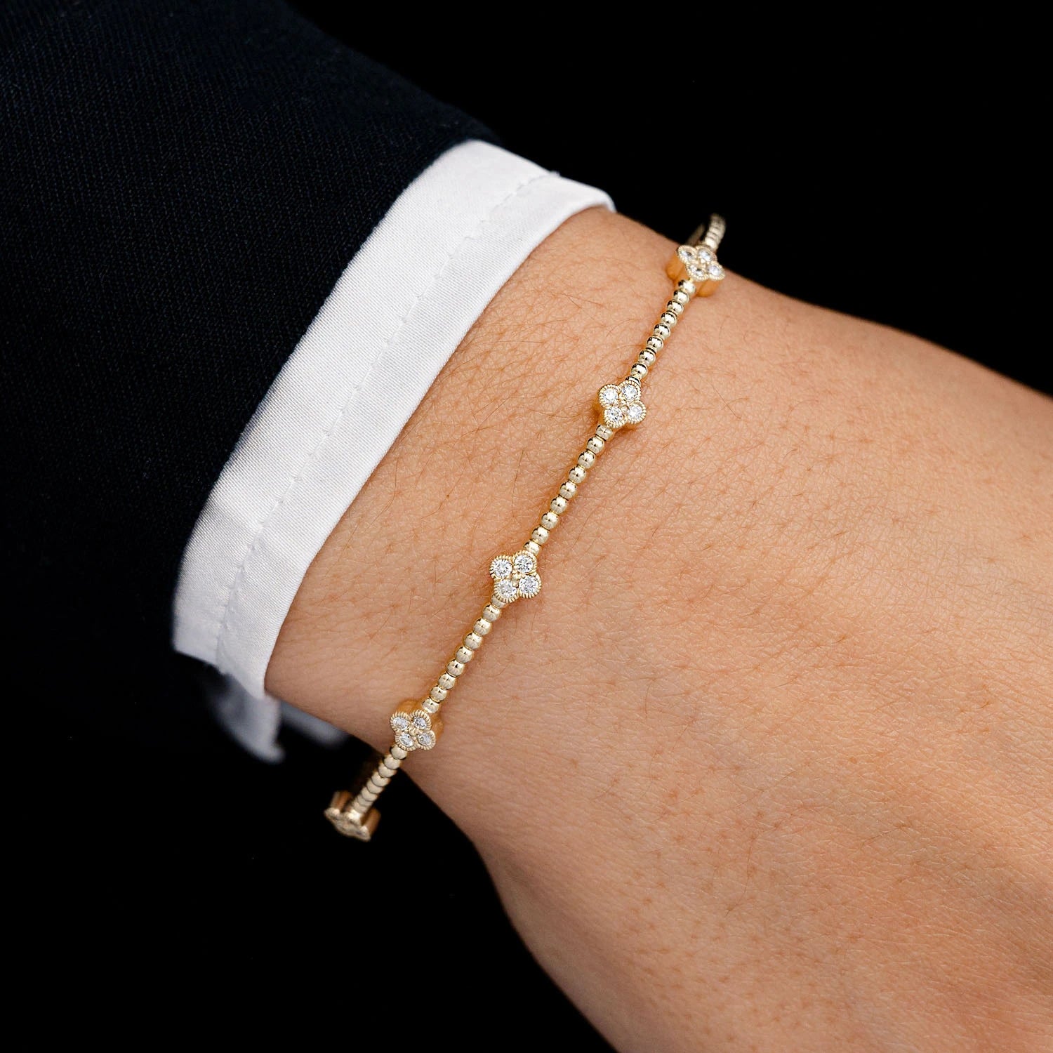Milgrain Clover Diamond Flex Bangle Bracelet in 14K yellow gold, 0.33ctw, detail view