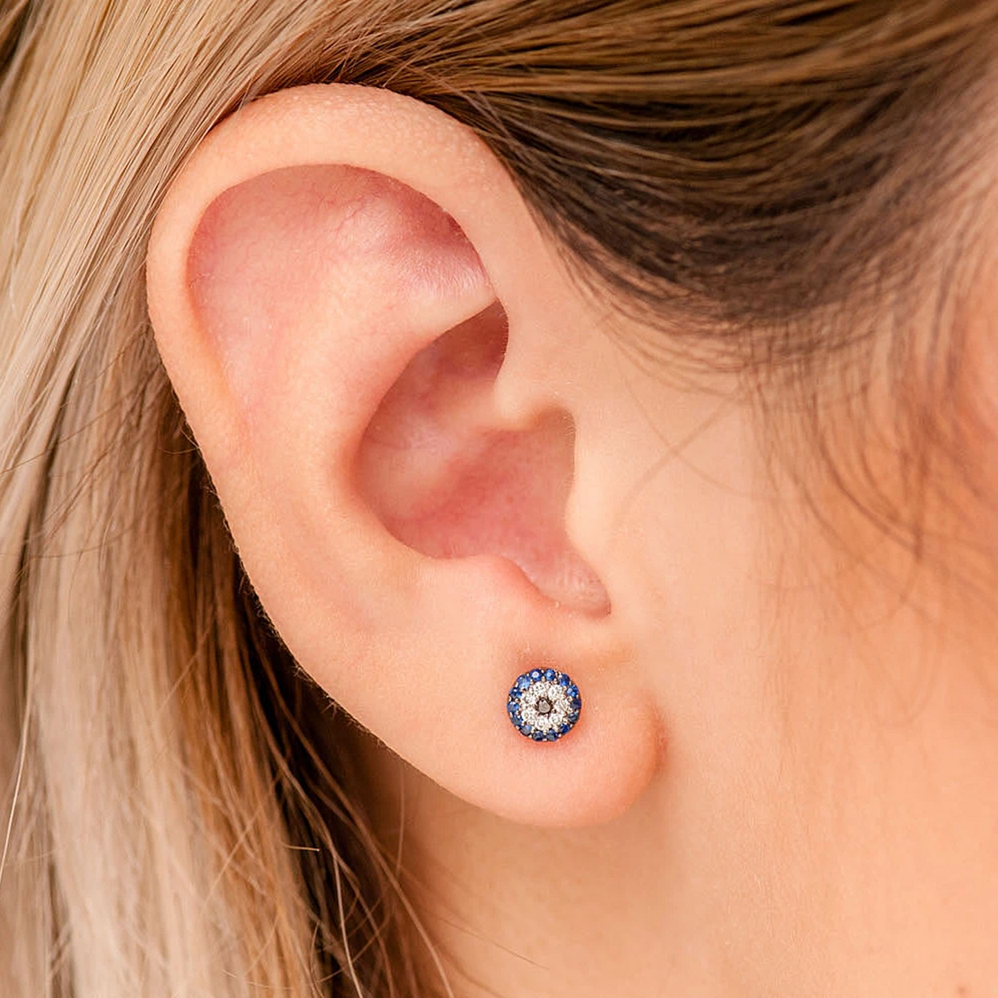 Round Evil Eye Diamond Studs in 14K white gold, angled view