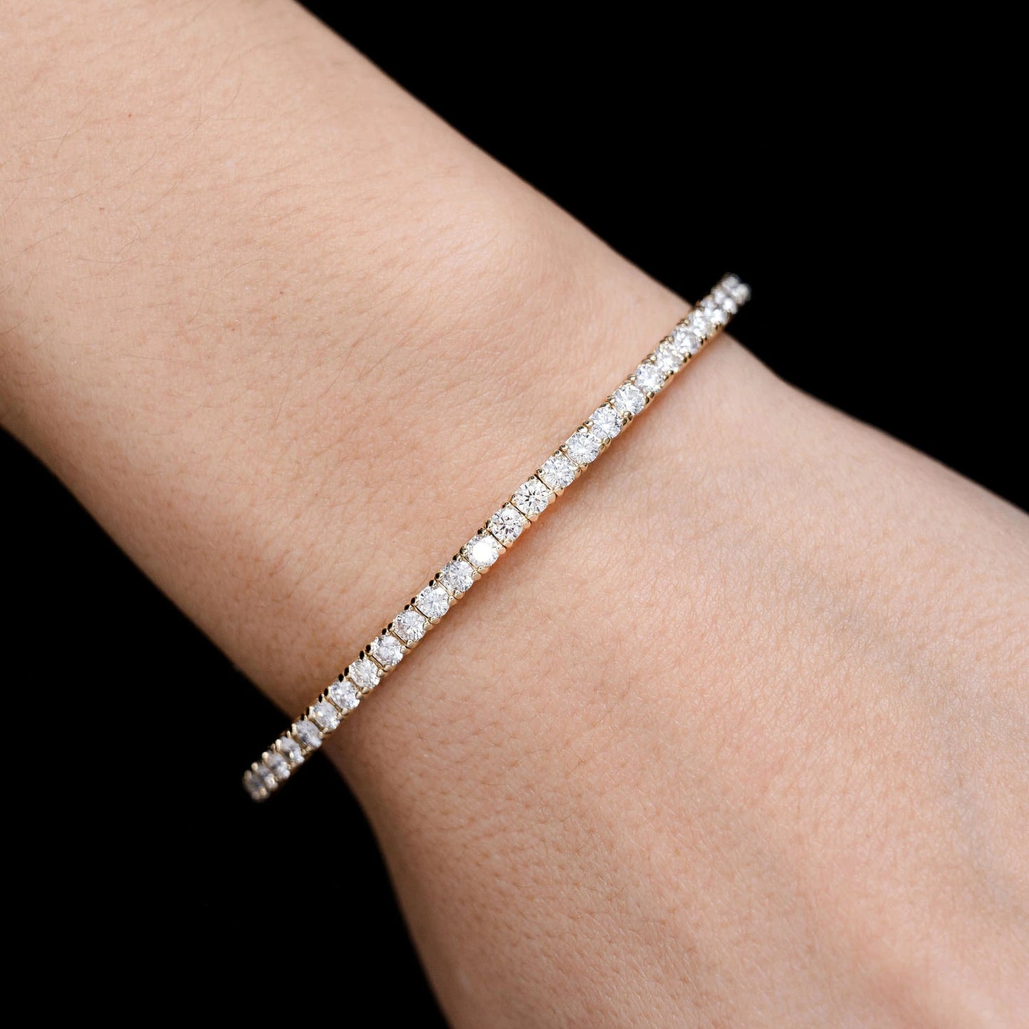 Prong Diamond Flex Bangle in 14K yellow gold, 8pt / 2.90ctw, angled view