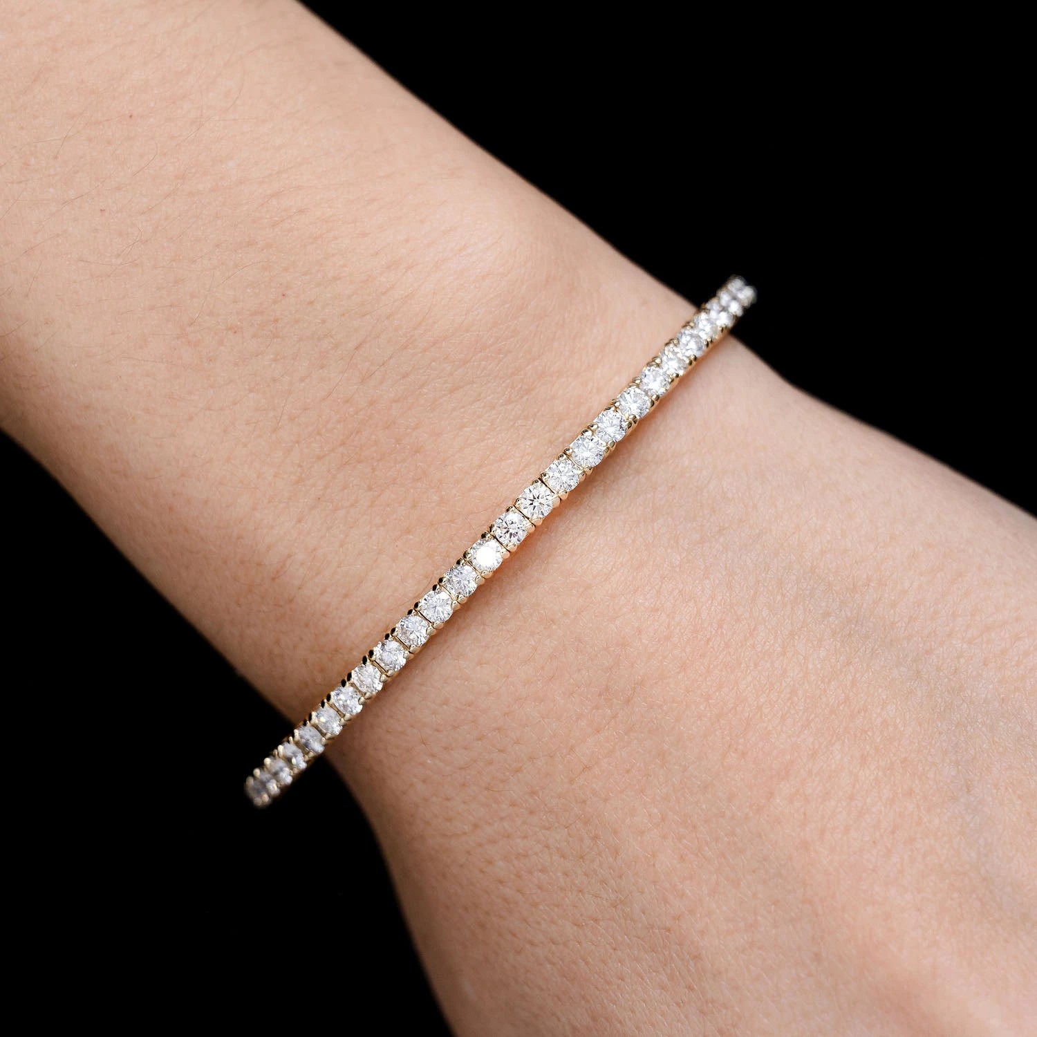 Prong Diamond Flex Bangle in 14K yellow gold, 8pt / 2.90ctw, angled view