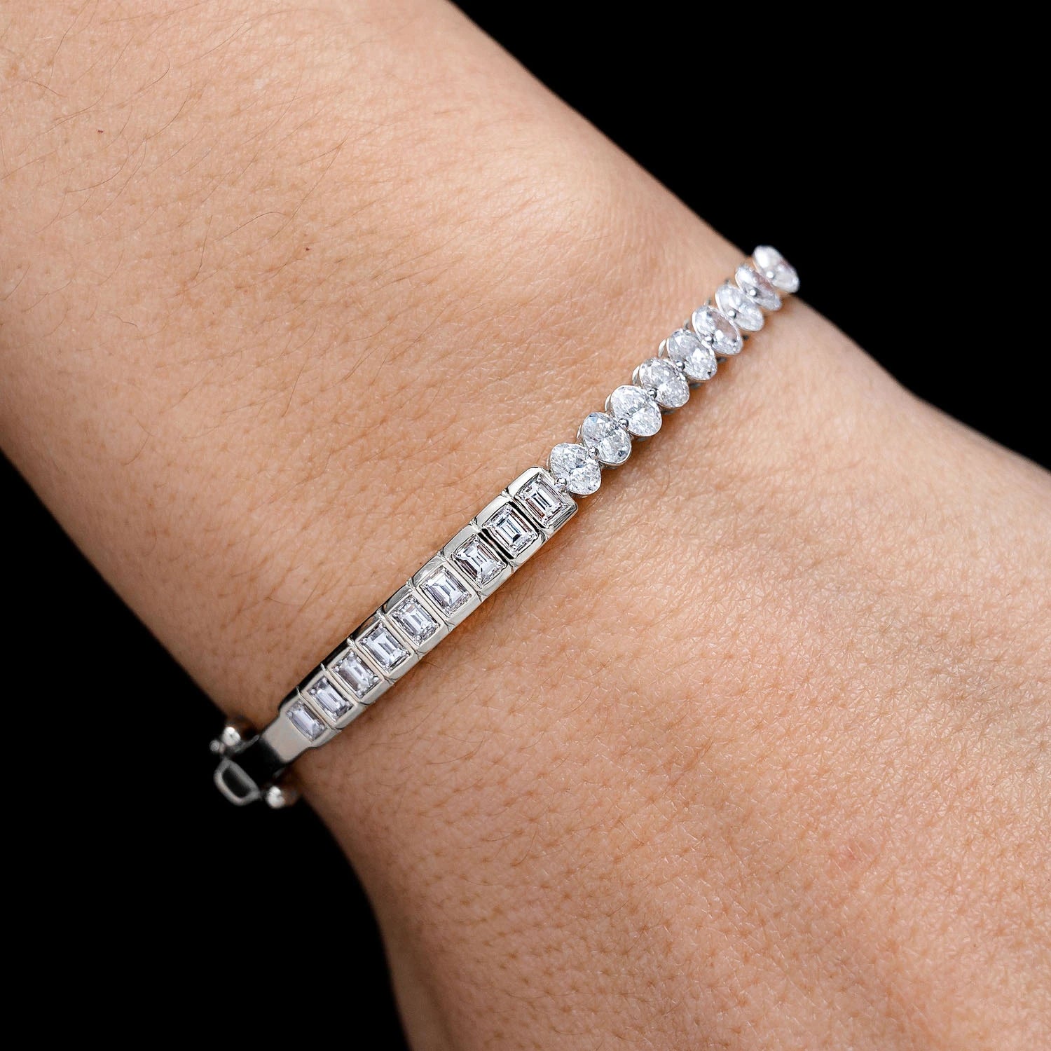 Bezel Baguette & Oval Diamond Bangle Bracelet in 14K white gold, angled view