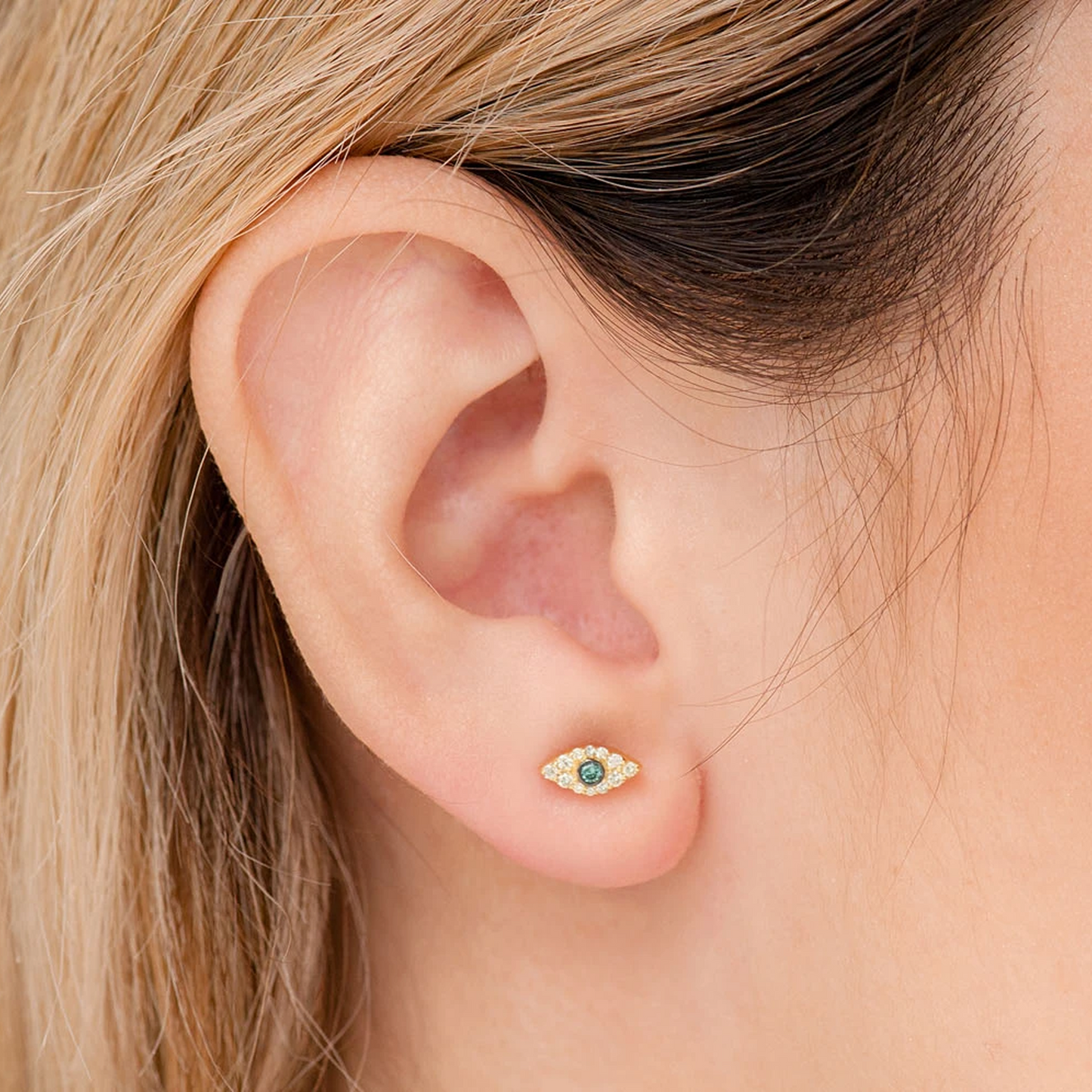 Evil Eye Diamond Studs in 14K rose gold, angled view