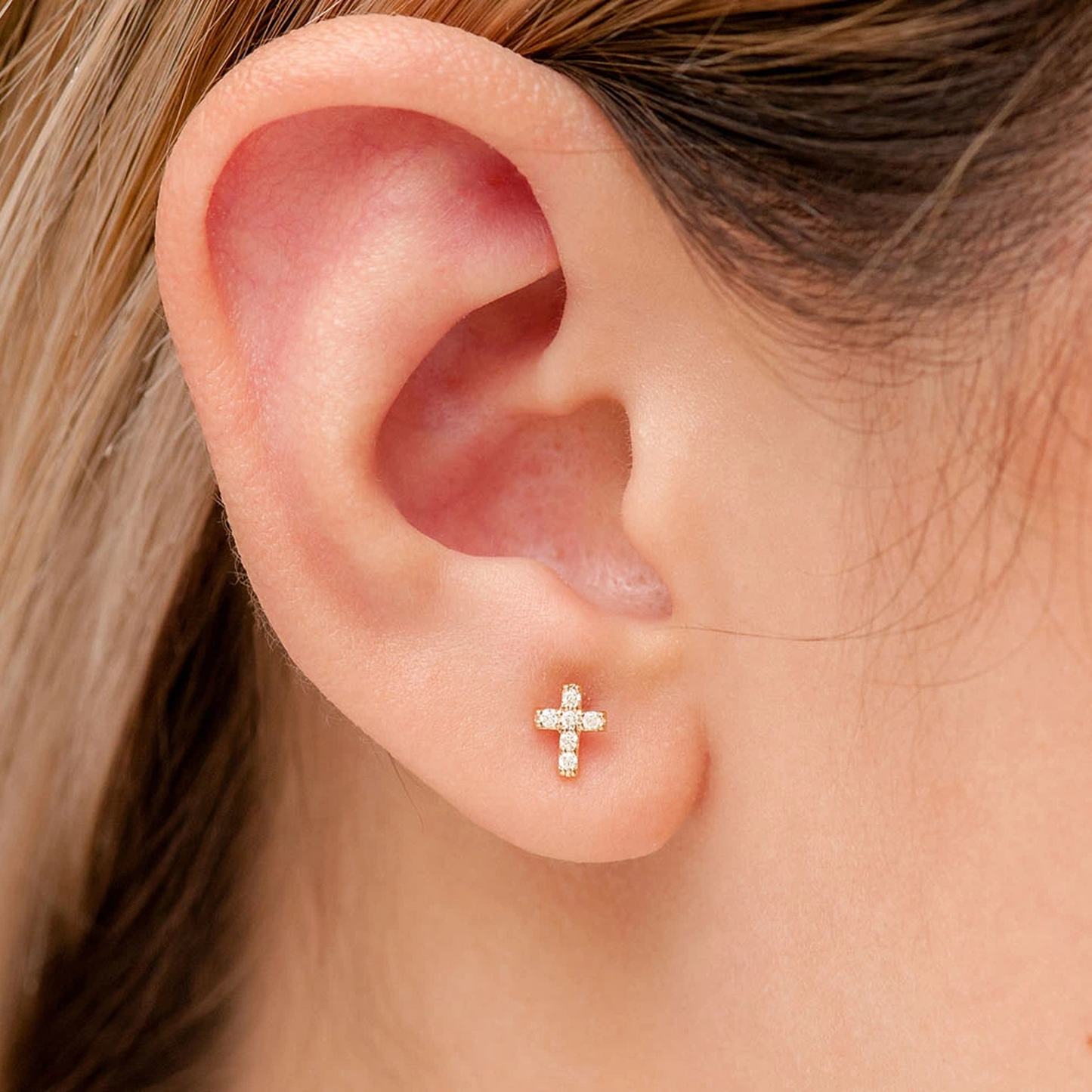 Cross Diamond Stud Earrings in 14K yellow gold, angled view