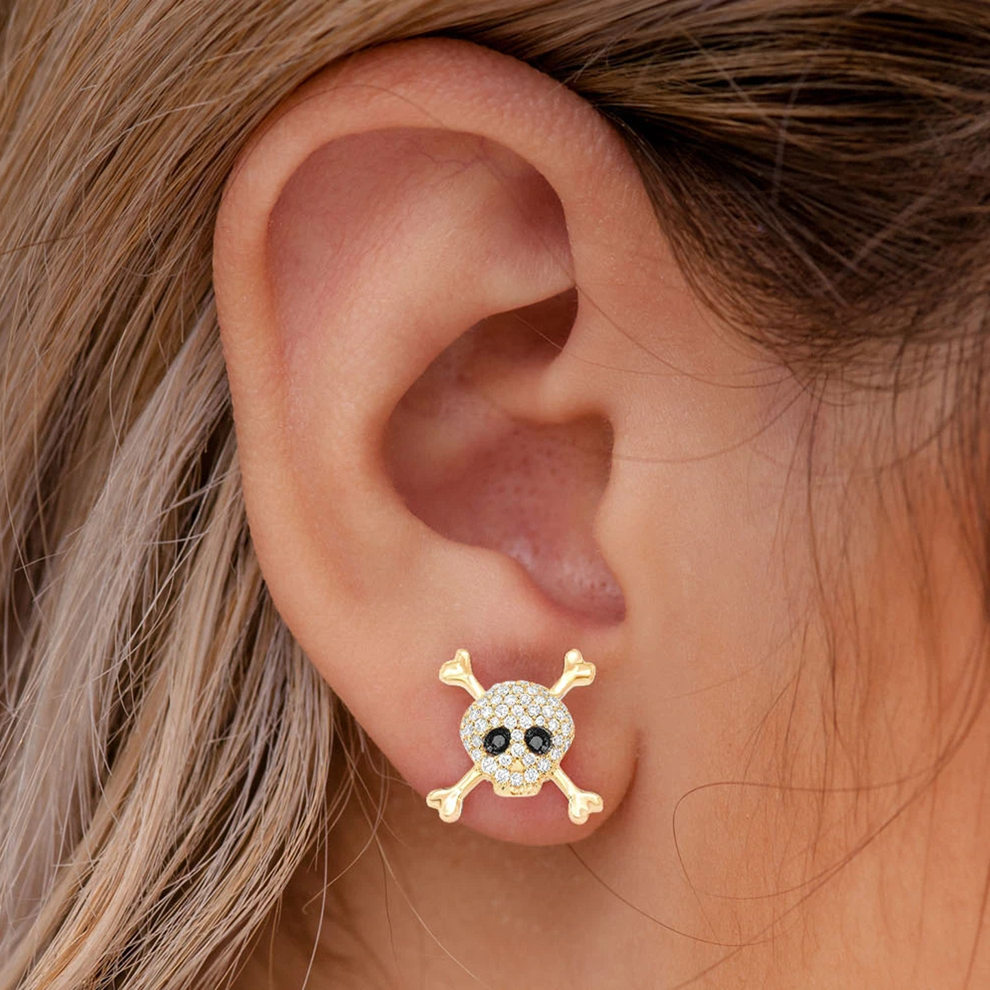 Skull & Crossbones Diamond Studs in 14K yellow gold, angled view