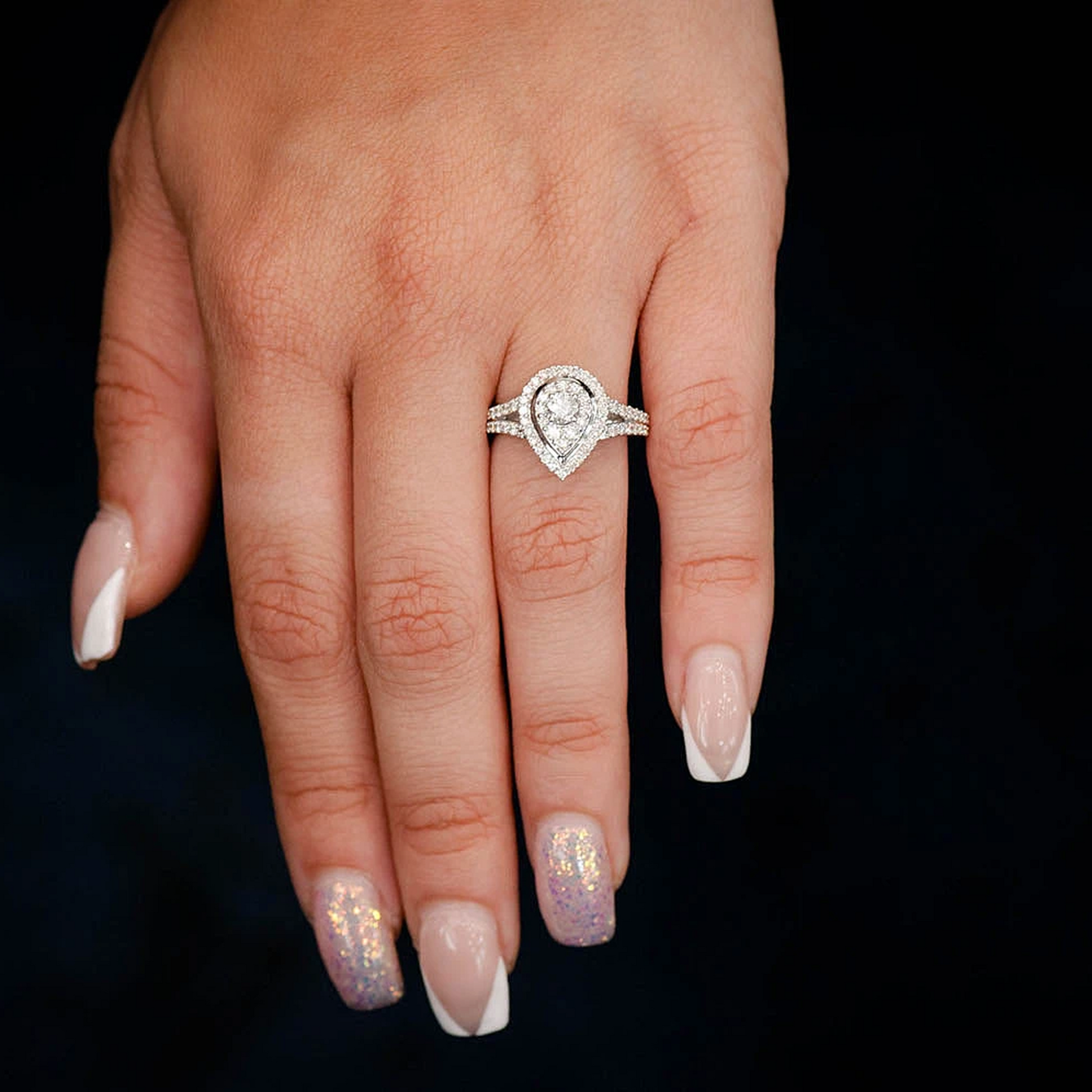 Double Halo Pear Diamond Engagement Ring in 14K yellow gold, worn view