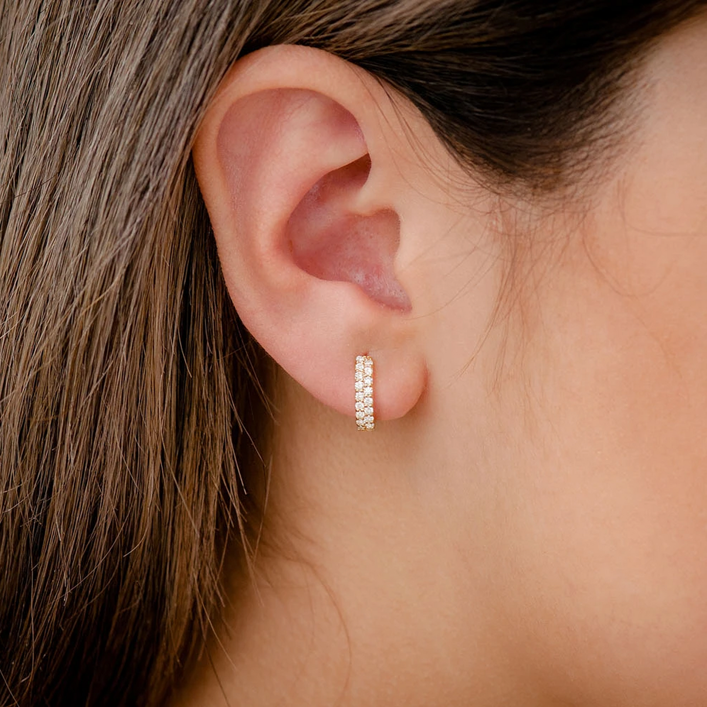 Two Row Pavé Diamond Huggie Hoop Earrings in 14K rose gold, angled view