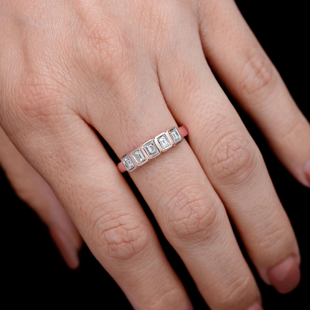 5 Stone Baguette Bezel Ring 14k in rose gold, worn on hand
