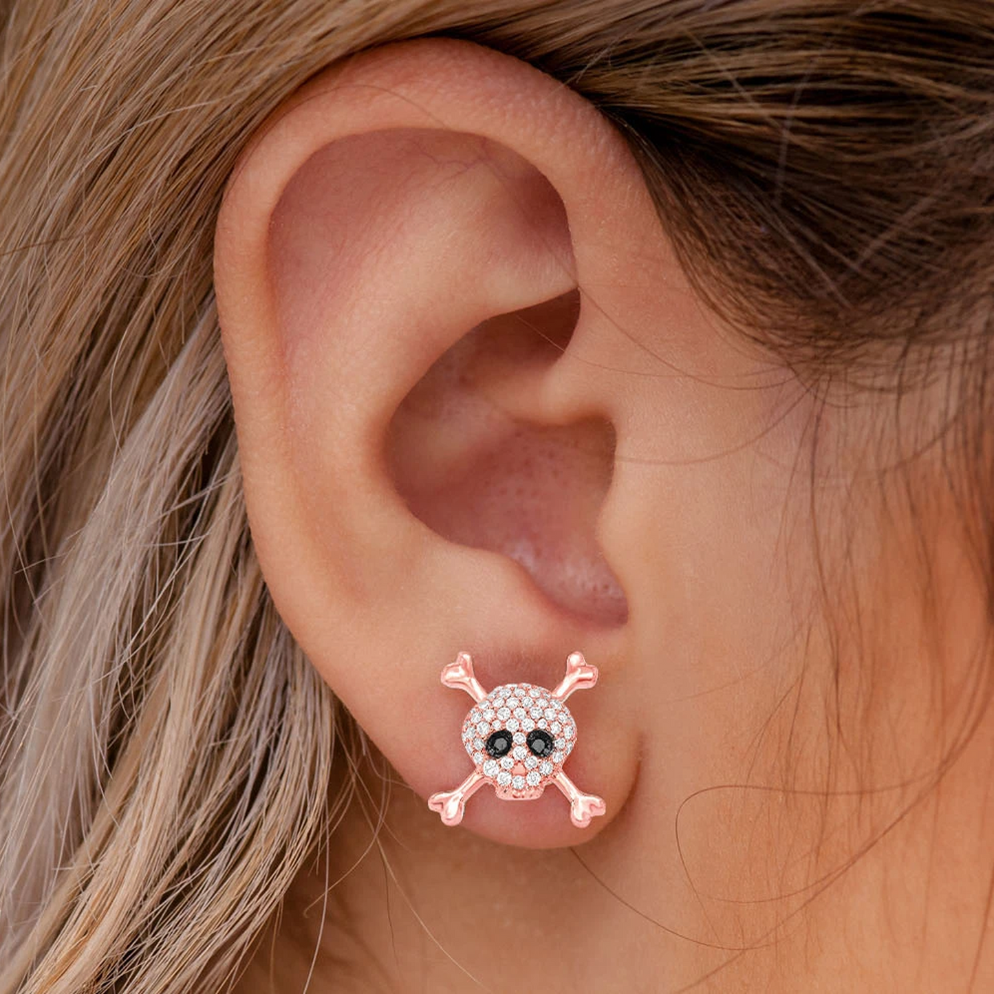 Skull & Crossbones Diamond Studs in 14K rose gold, angled view