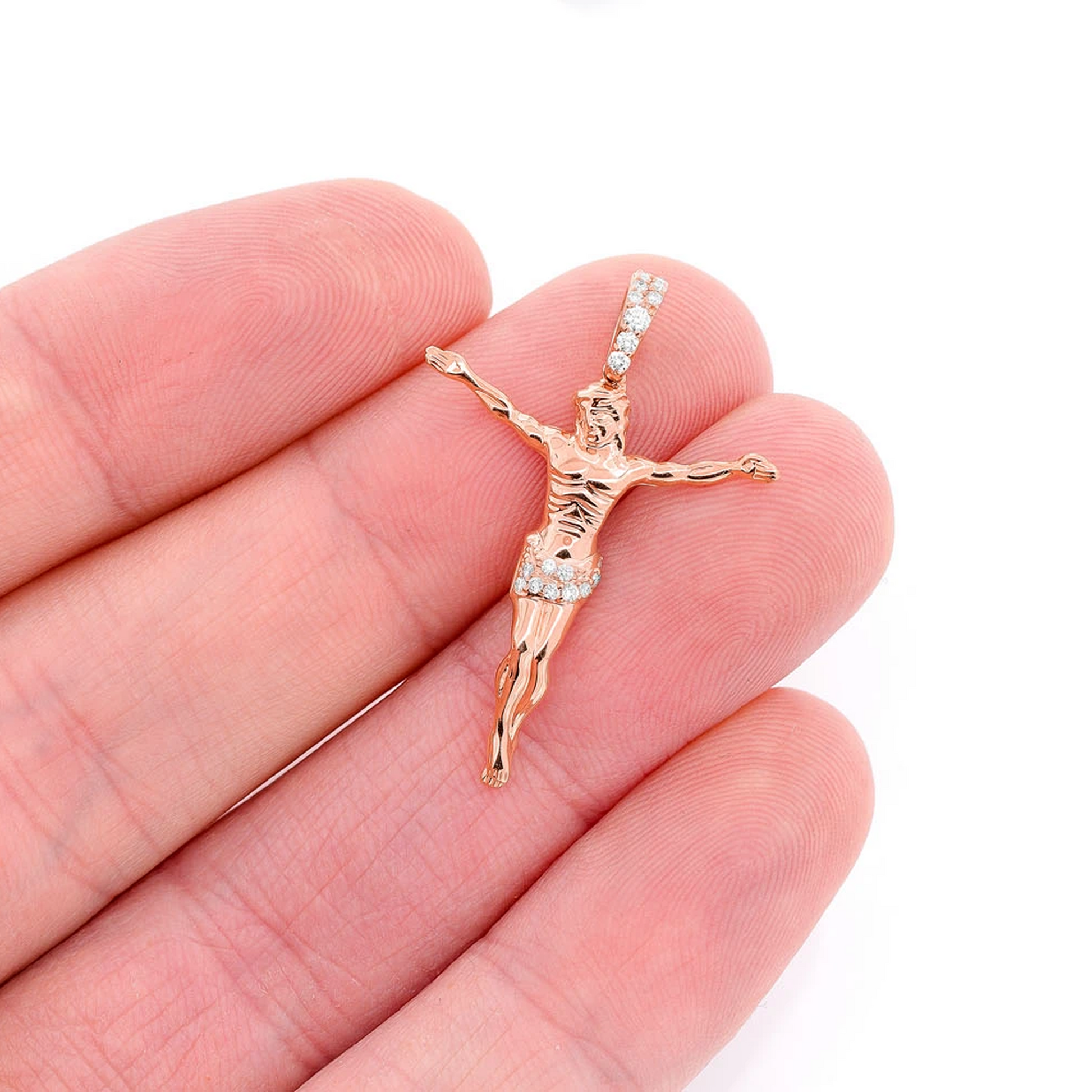 Jesus Crucifix Diamond Pendant in 14K rose gold, Signature | 0.10ctw | Half-Diamond, angled view