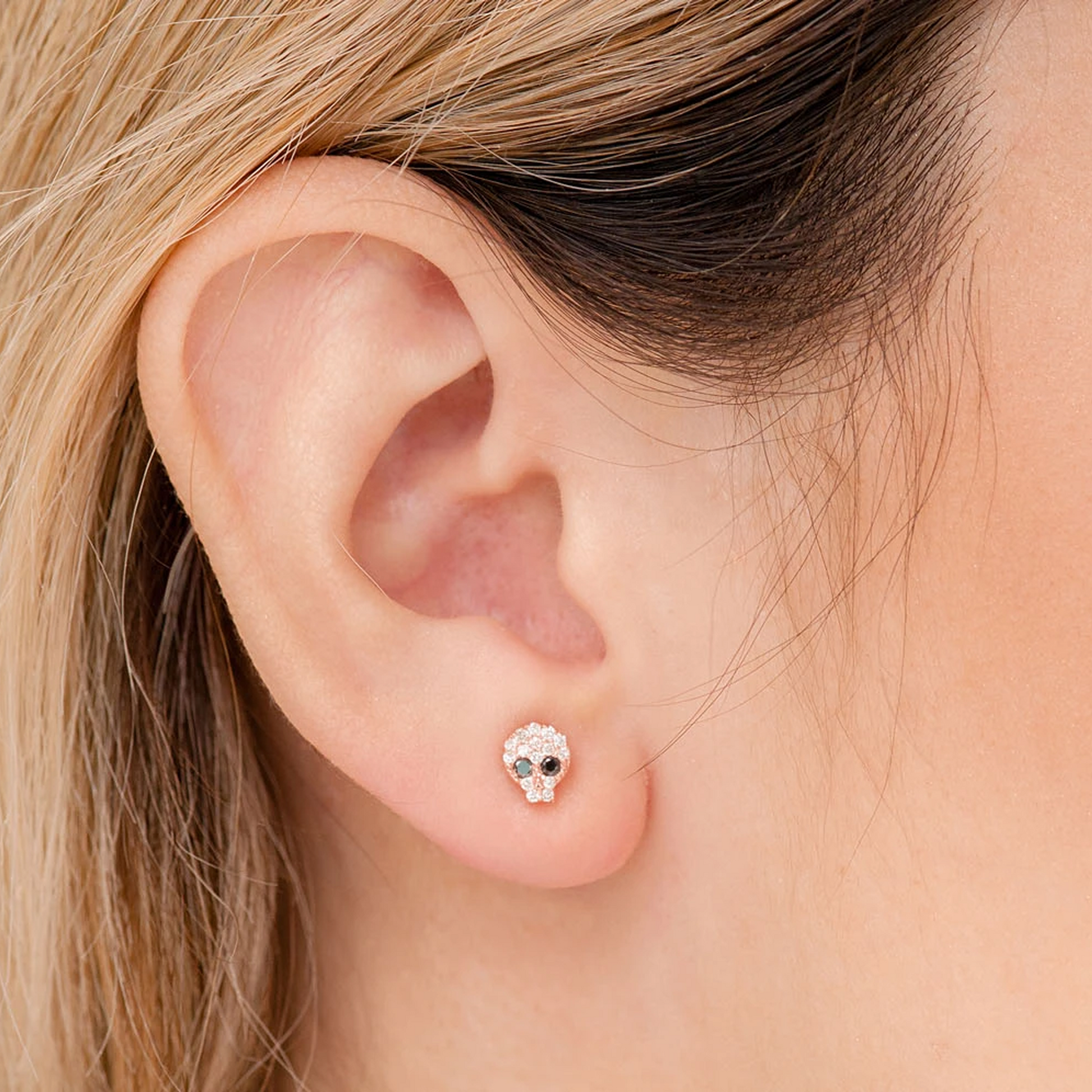 Skull Diamond Stud Earrings in 14K rose gold, angled view
